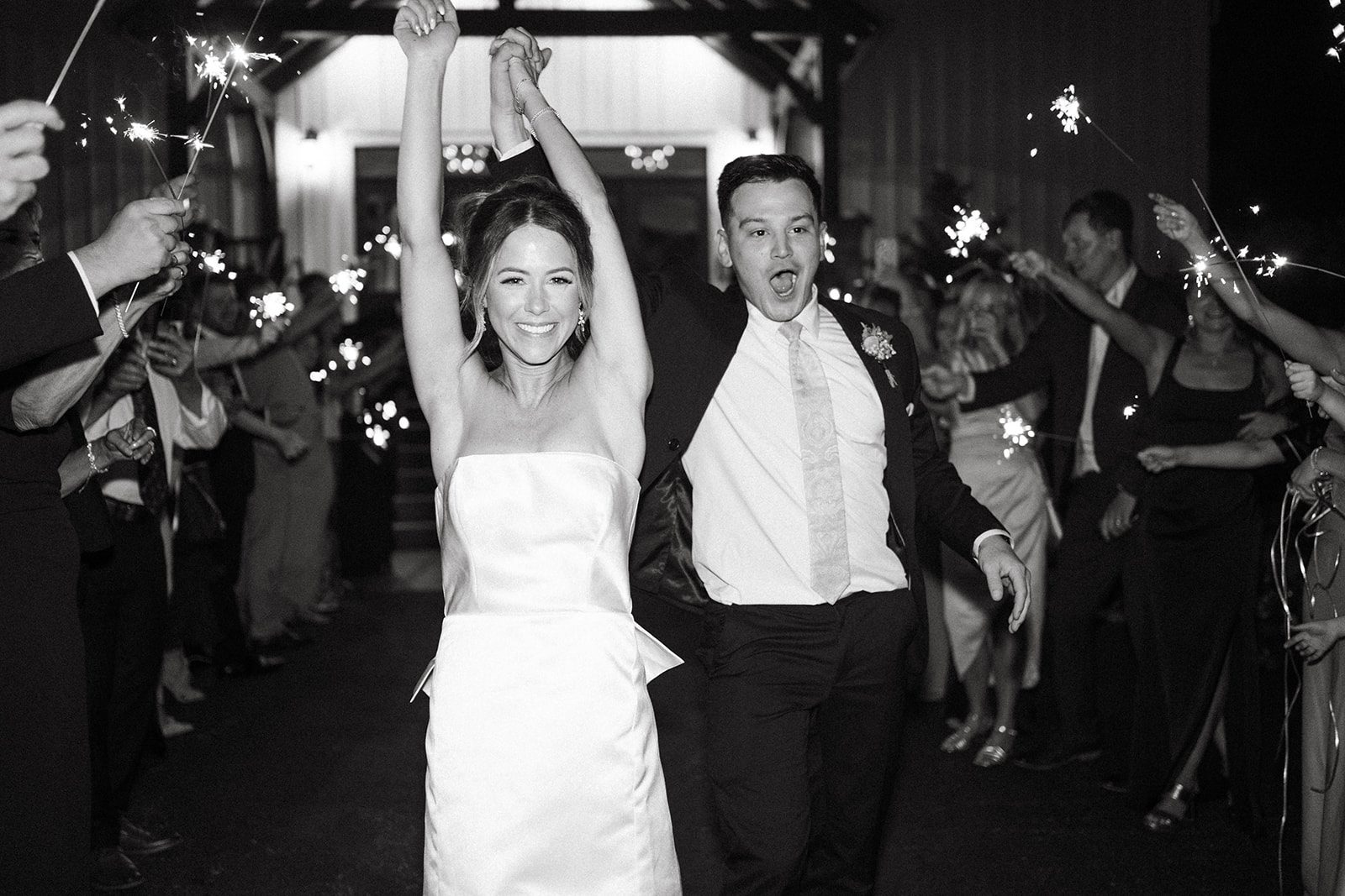 Couple during their sparkler exit after their wedding